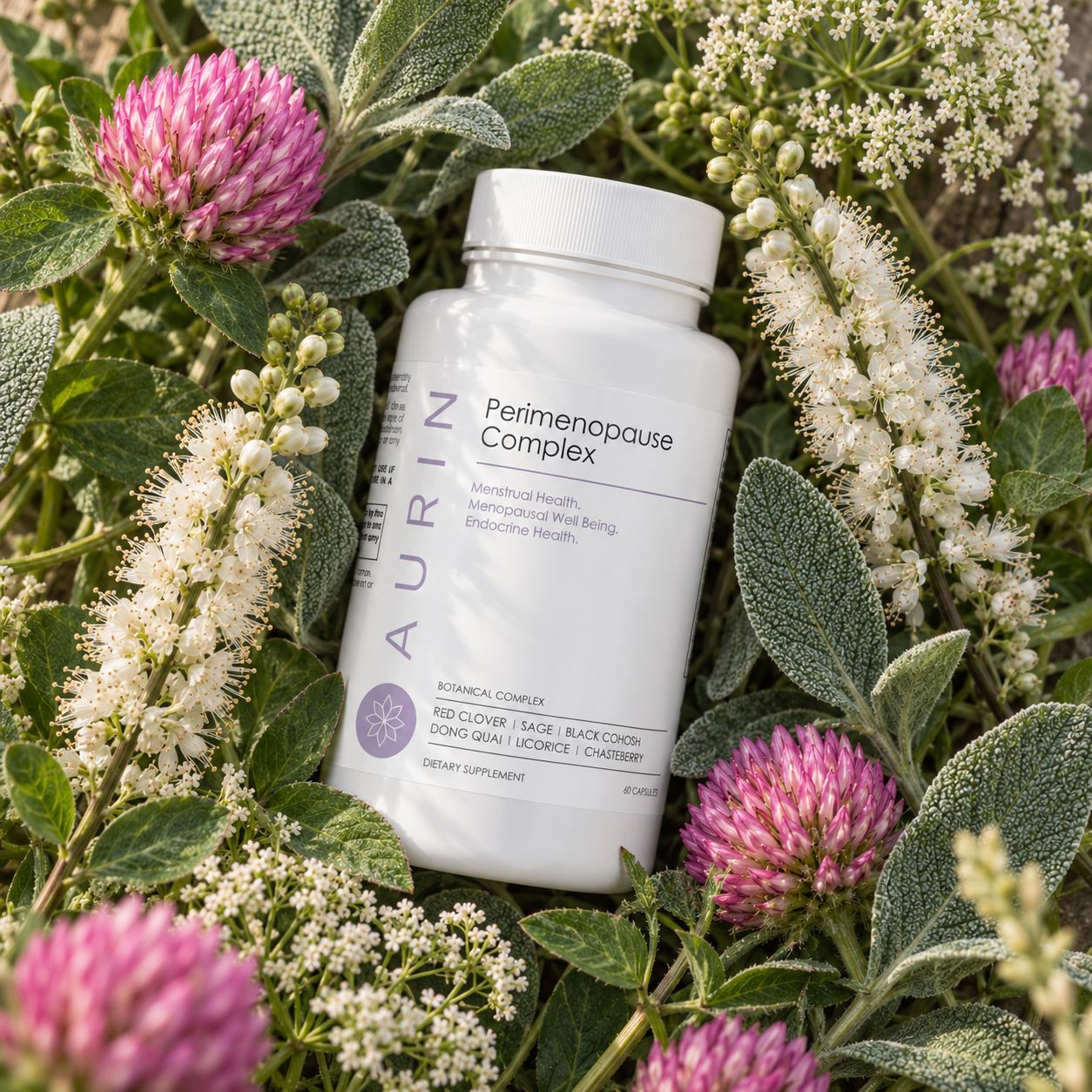 A bottle of AURIN Perimenopause Complex among red clover, sage and black cohosh flowers